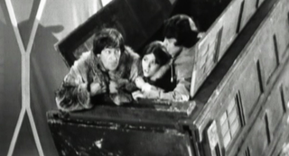 The TARDIS crew emerge from the ship in an undignified fashion.